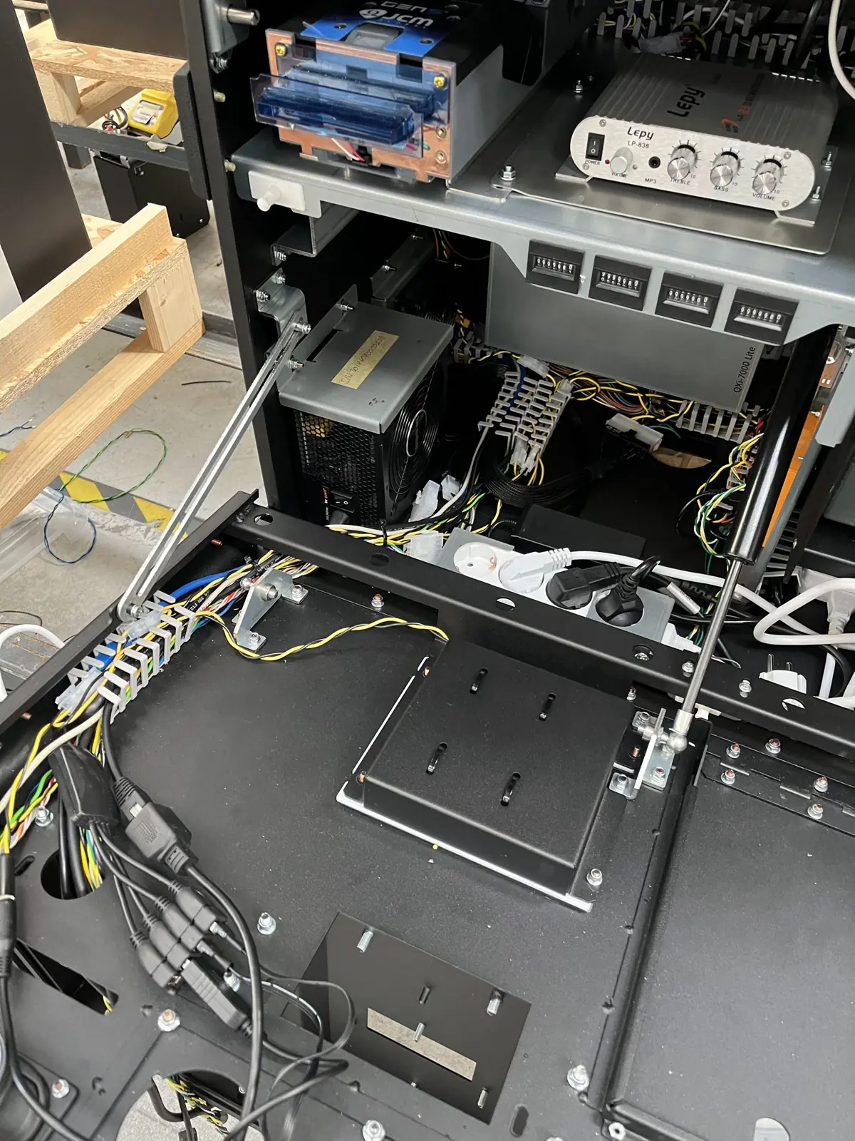 Sheet-metal chassis with power supply, wiring and hardware fitted in-house