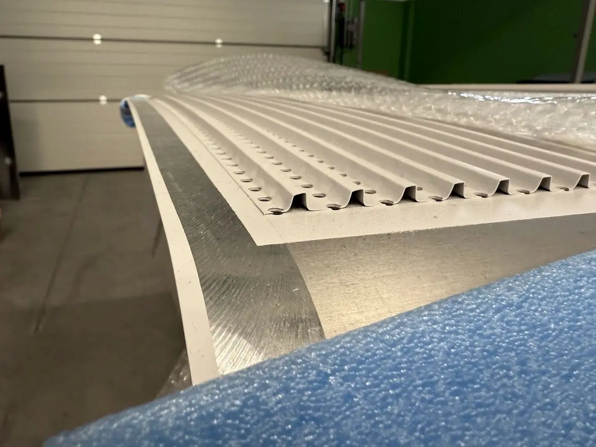 Long perforated rack panel on the shop floor
