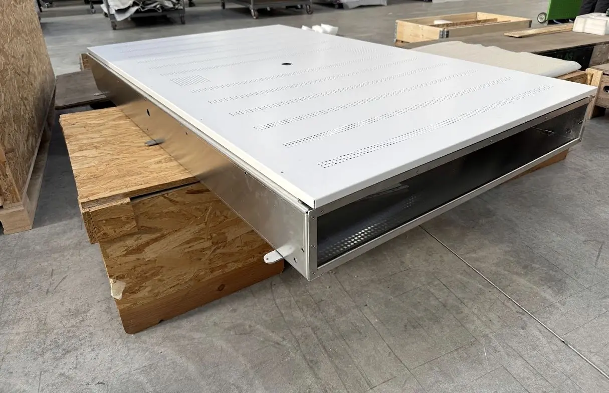 Powder-coated enclosure on a pallet before packing